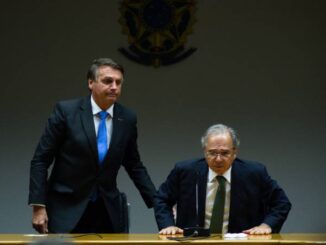 BRASILIA, BRAZIL - OCTOBER 22: (L-R) President of Brazil Jair Bolsonaro and Minister of Economy Paulo Guedes  Andressa Anholete/Getty Images