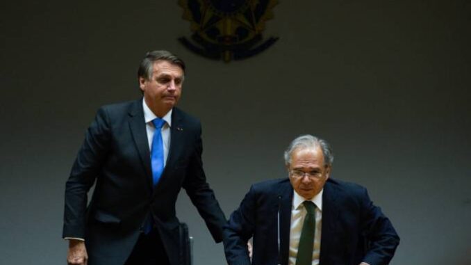BRASILIA, BRAZIL - OCTOBER 22: (L-R) President of Brazil Jair Bolsonaro and Minister of Economy Paulo Guedes  Andressa Anholete/Getty Images